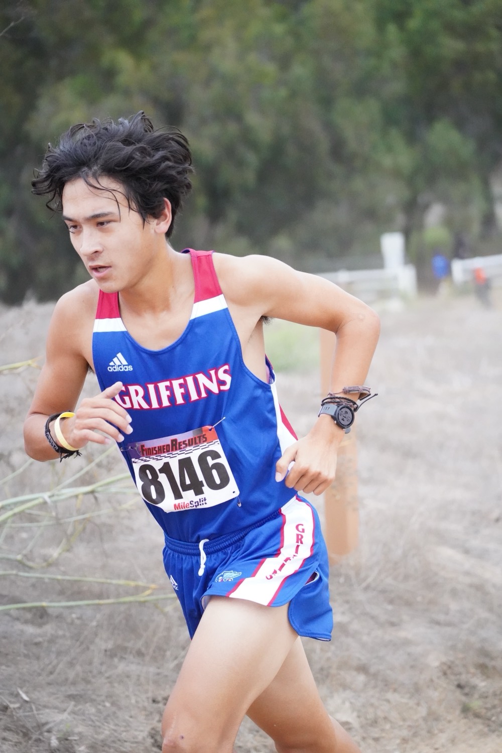Daniel mid-race in a cross-country singlet